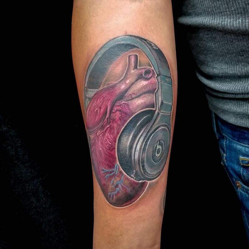 Heart tattoo,headphones,Overlord tattoo shop Palm Coast FL