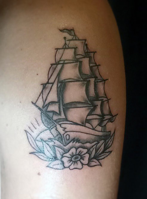 Ship tattoo done by Brian Haggerty at Overlord Tattoo Studio, Palm Coast, Flagler Beach FL. 